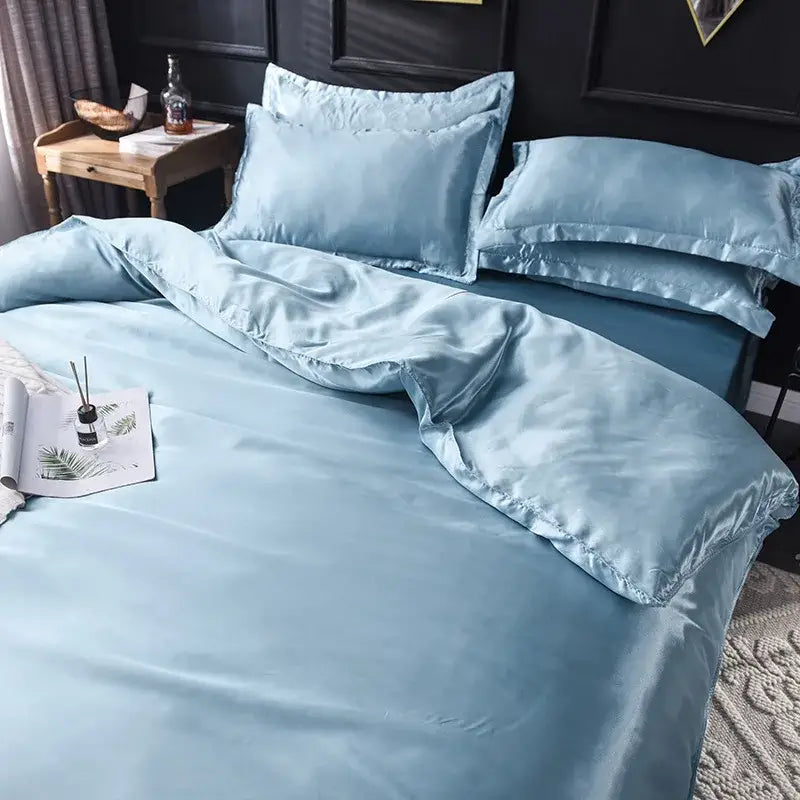 Light blue satin bedding set with a smooth glossy finish and matching pillowcases from decorbites ice rayon satin