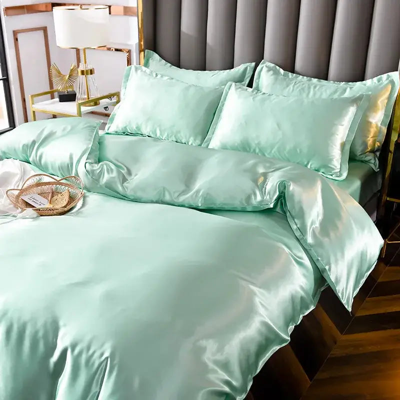 Luxe mint green satin bedding set with glossy finish and matching pillowcases from decorbites ice rayon satin collection