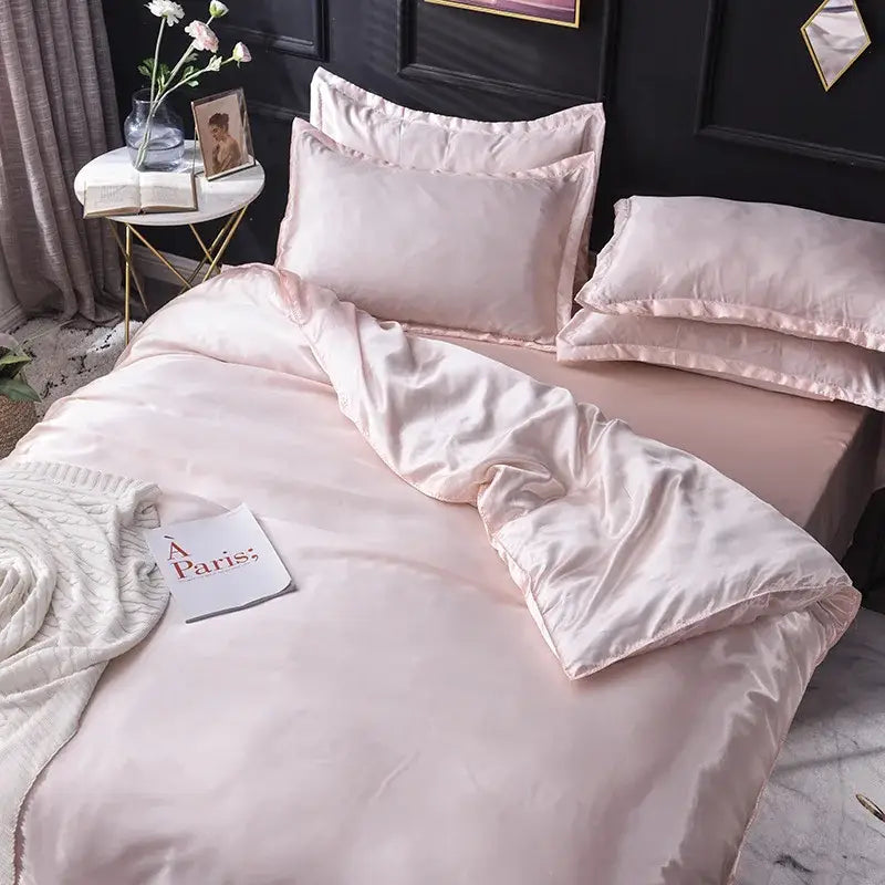 Pink satin bedding set with matching pillows and duvet cover made of decorbites ice rayon satin for cooling comfort