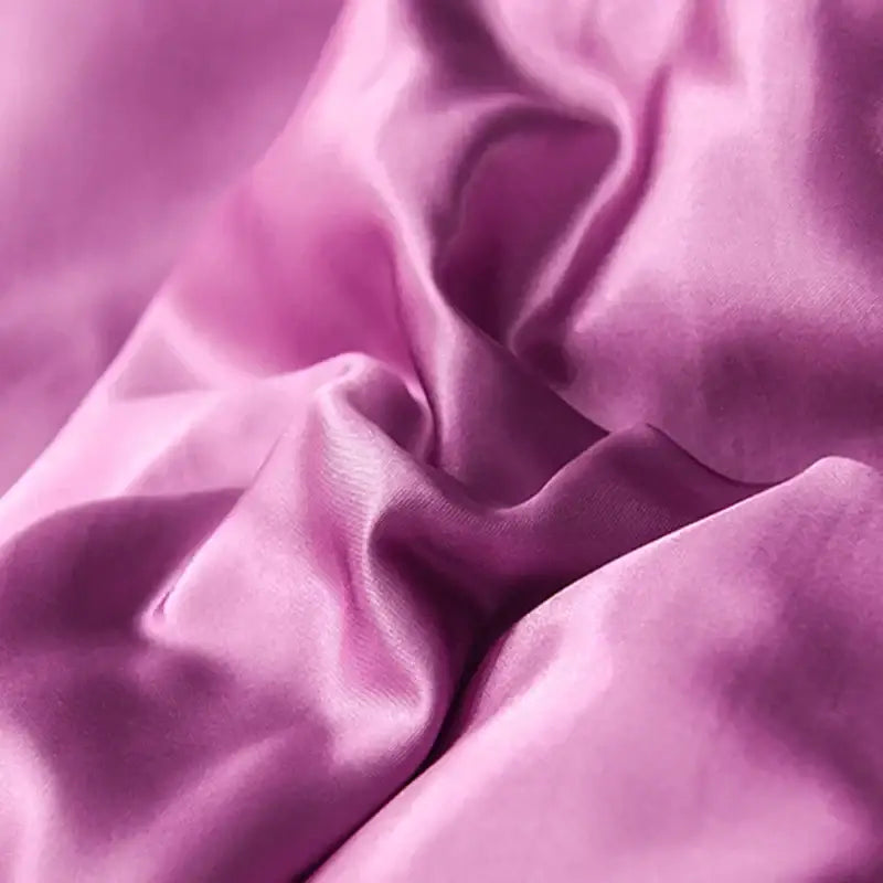 A soft flowing lavender ice rayon satin fabric with smooth glossy finish for decorbites ice rayon bedding set