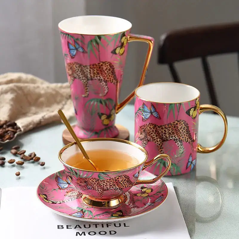 Pink jungle animals bone china teacup and saucer set with gold trim featuring leopards and butterflies for dining room decorbites jungle animals