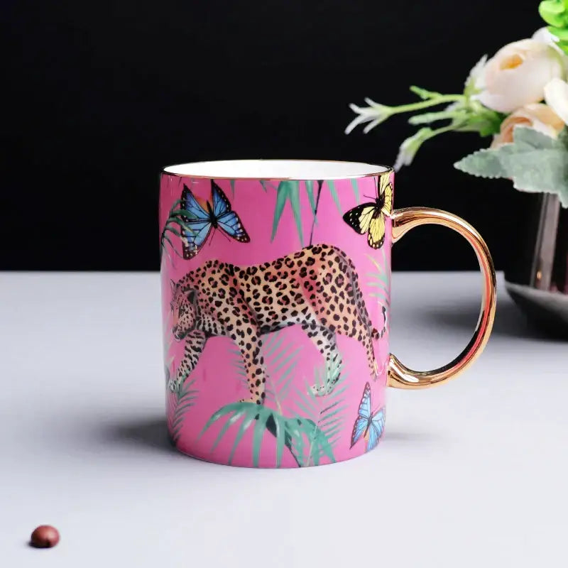 Pink jungle animals bone china teacup and saucer set featuring a vibrant leopard illustration and gold handle decorbites jungle animals