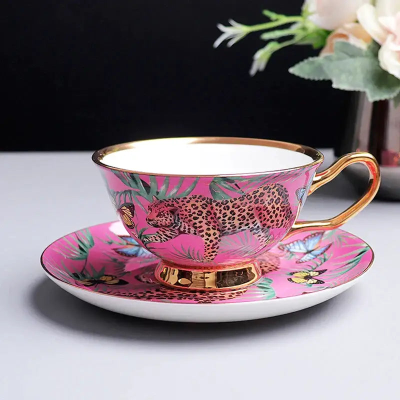 Pink jungle animals bone china teacup and saucer set with leopard and butterfly motif accented by gold trim for decorbites jungle animals collection