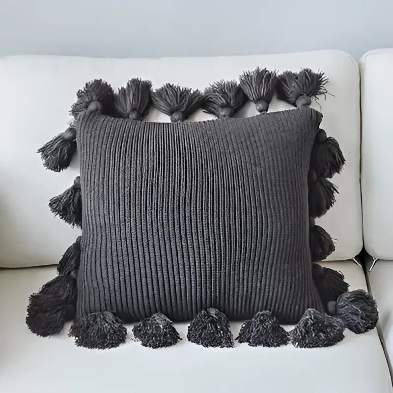 Dark gray ribbed knit cushion cover with matching tassels on all sides decorbites knit cushion for living room decor