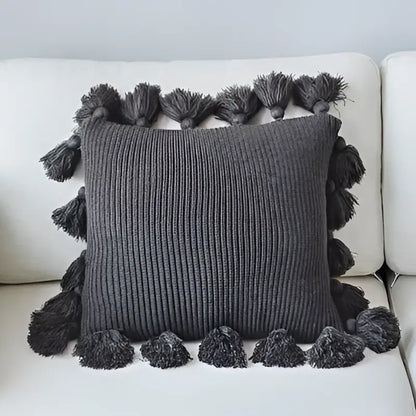 Dark gray ribbed knit cushion cover with matching tassels on all sides decorbites knit cushion for living room decor