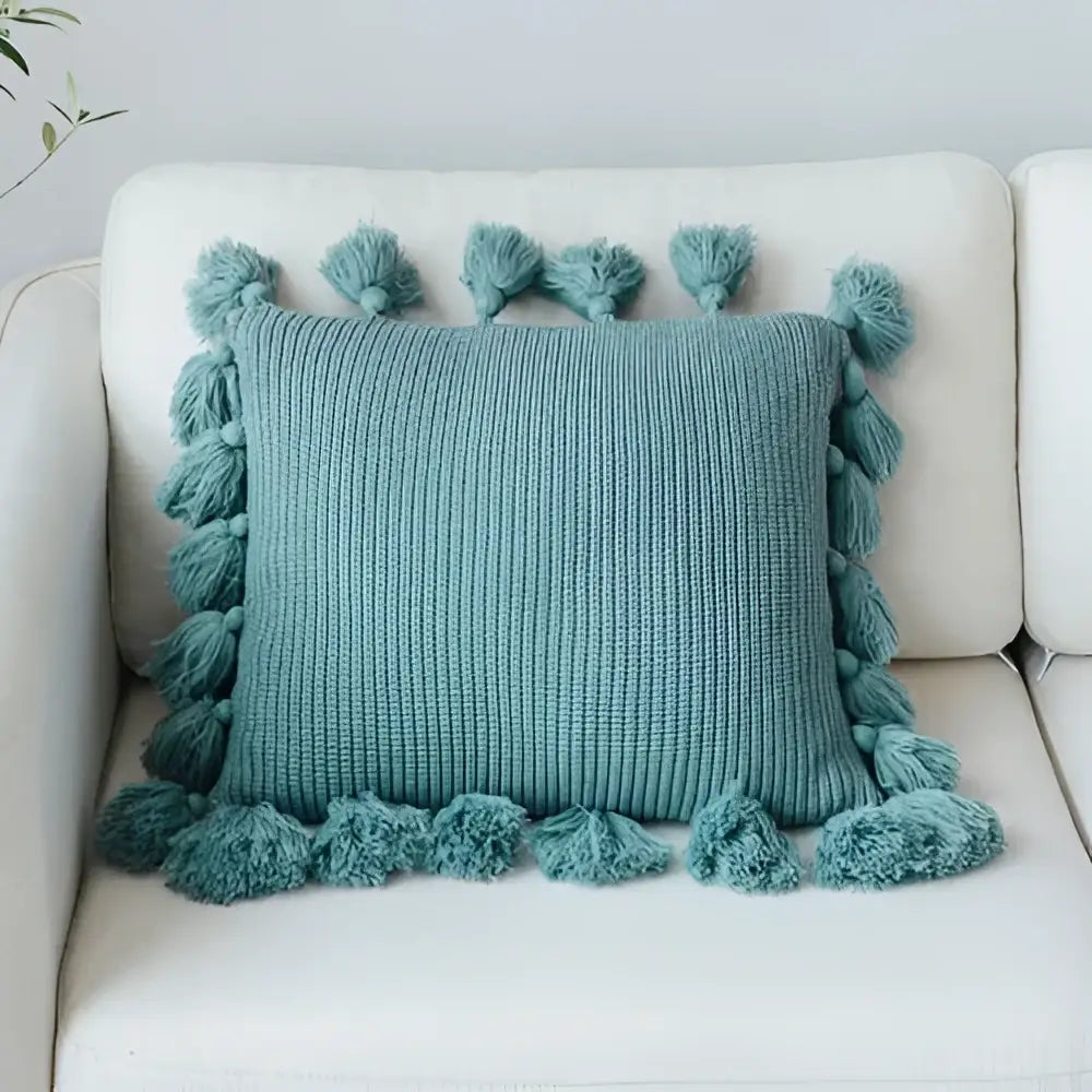 Teal knit cushion cover with fluffy tassels on all sides perfect for decorbites knit cushion living room decor
