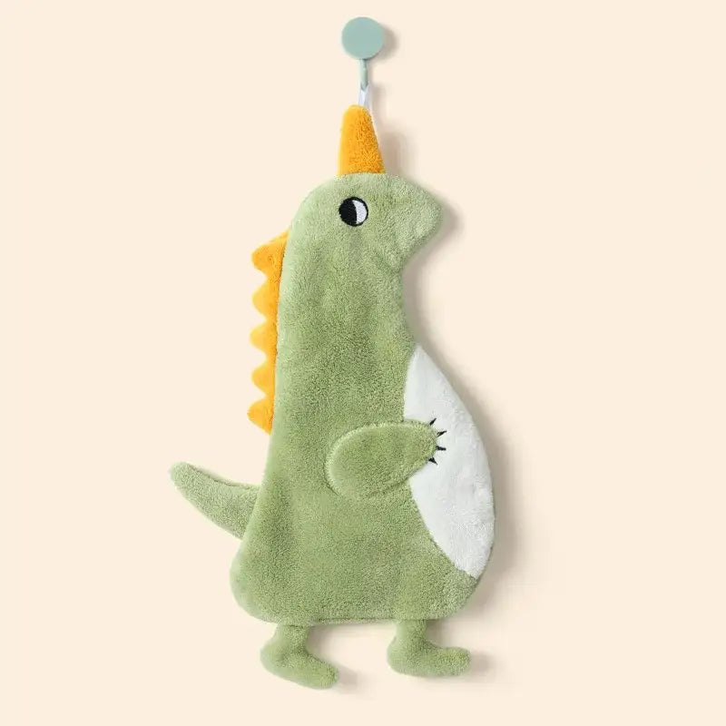 A soft green plush cartoon animal shape towel with yellow horn and spines for decorbites cartoon animal bathroom decor