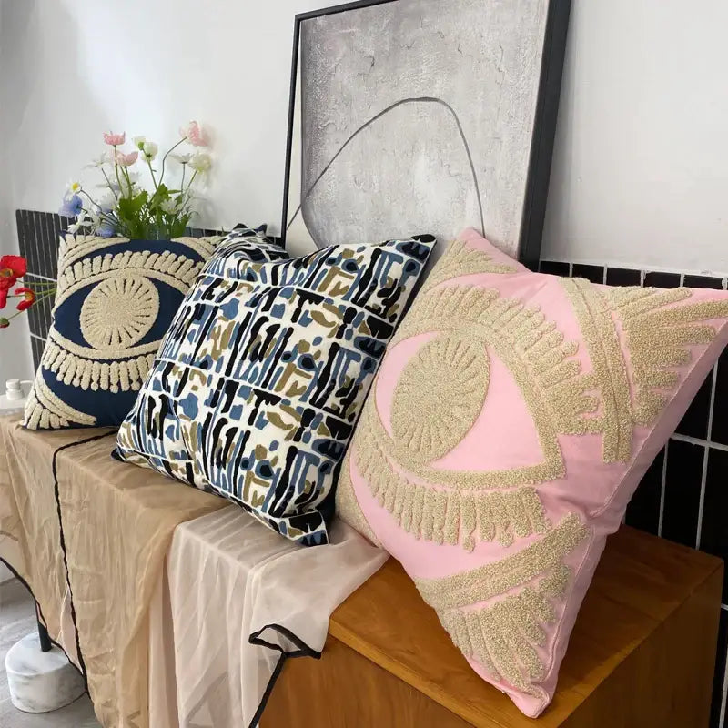 Pink and navy embroidered cotton throw pillow cover with gold eye design for living room decor