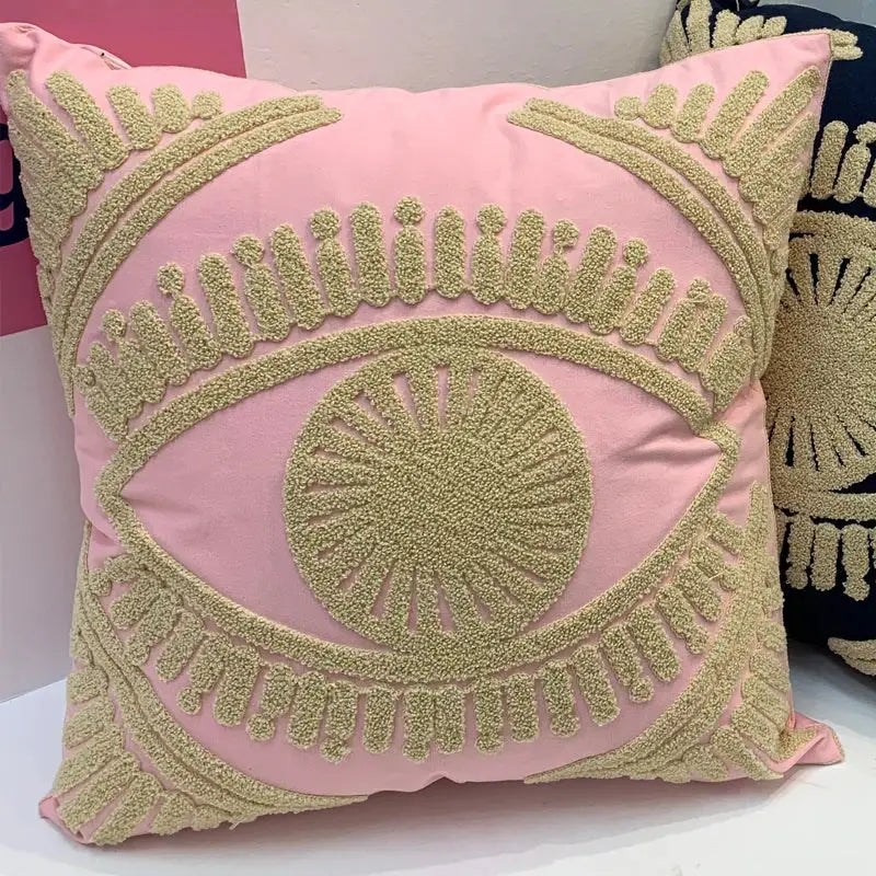 Pink cushion with textured gold embroidered eye design on cotton throw pillow cover for living room decor
