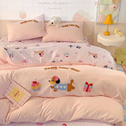 Pink new year dog cotton bedding set featuring embroidered dog, gift box, and cupcake appliqués for cozy decorbites cotton bedding