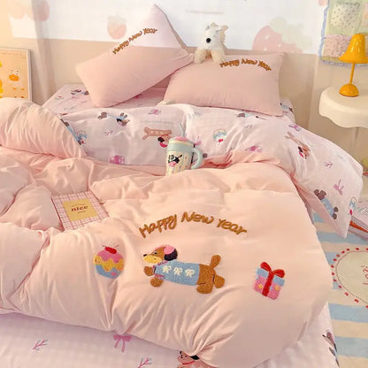 Pastel pink quilted cotton bedding set with embroidered happy new year text and playful dog appliqués decorbites cotton bedding