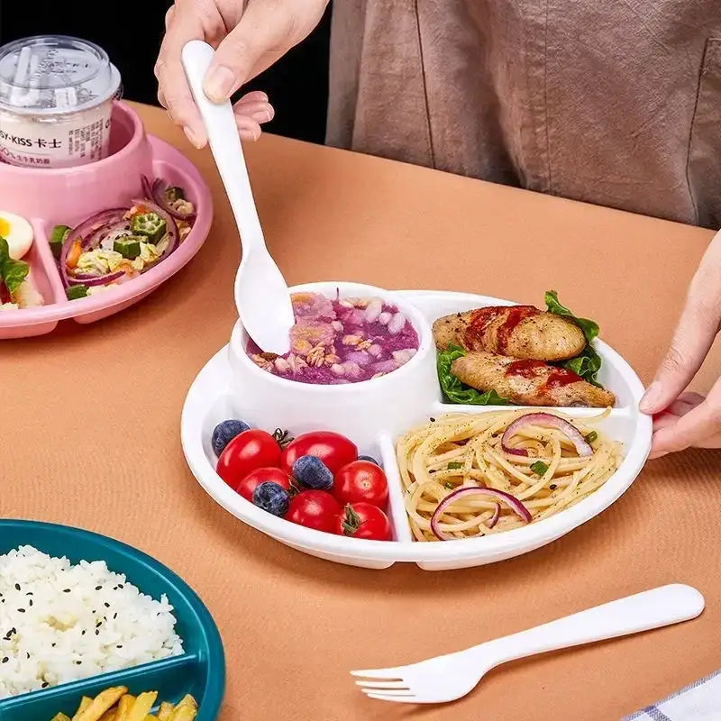 White plastic portion control plate with compartments for soup pasta chicken and vegetables for kids meal tray