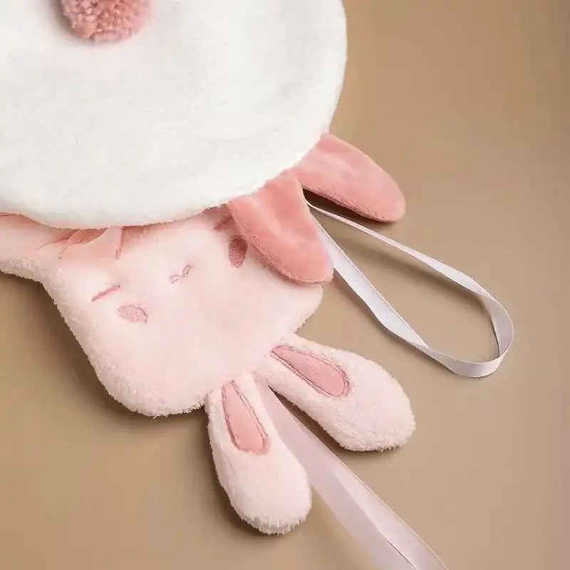 Pink plush hand towel shaped like a soft cartoon rabbit with embroidered features for bathroom and kitchen use decorbites cartoon rabbit