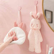 Soft pink plush cartoon rabbit hand towel hanging on a wall hook for bathroom and kitchen by decorbites cartoon rabbit