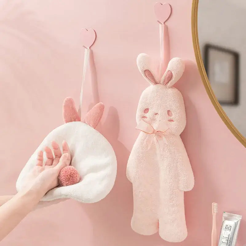 Soft pink plush cartoon rabbit hand towel hanging on a wall hook for bathroom and kitchen by decorbites cartoon rabbit