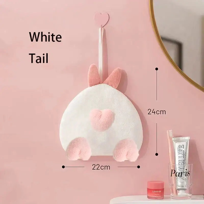 A plush white hand towel shaped like a cartoon rabbit tail with pink heart and paw details for decorbites cartoon rabbit decor