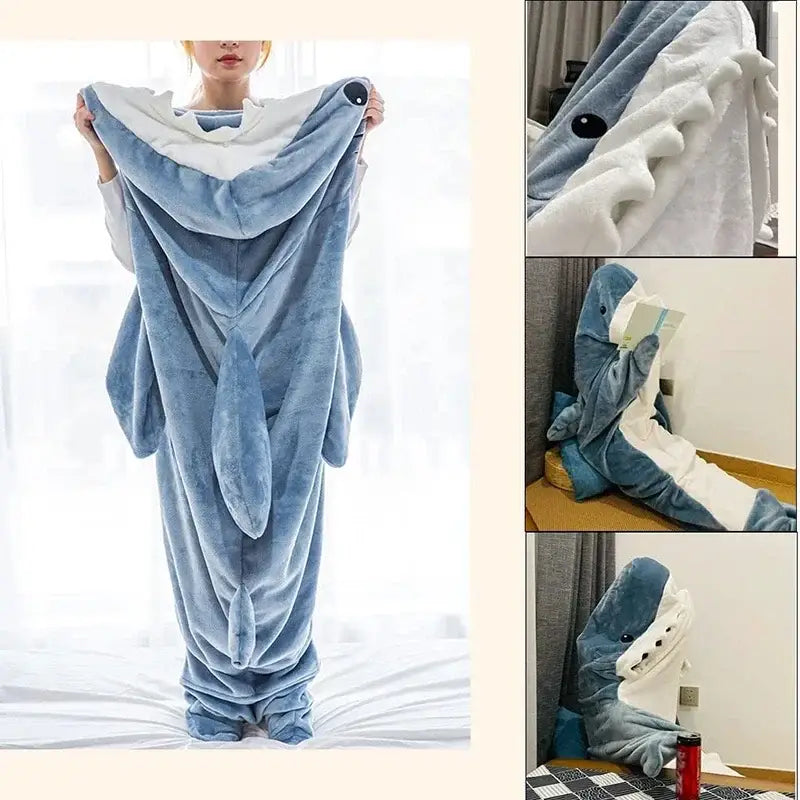 Blue plush shark-shaped sleep suit with white interior and black eyes from decorbites cozy shark blanket collection