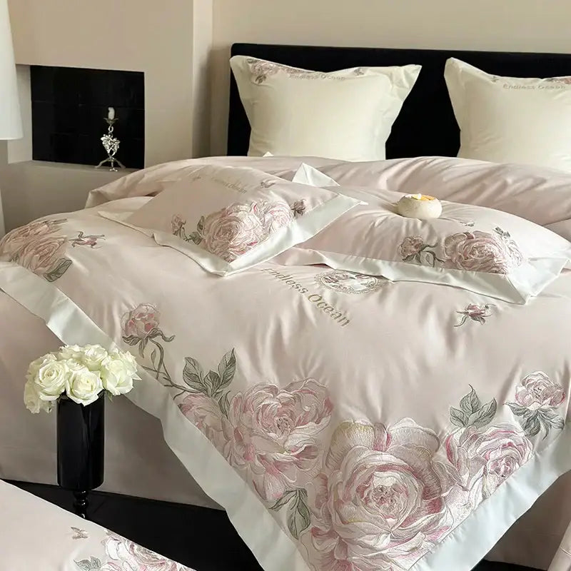 Delicate blush pink and cream floral embroidered bedding set with pink purple flowers on satin egyptian cotton fabric