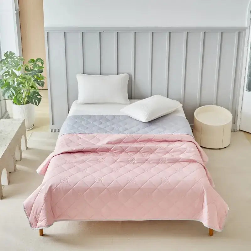 Pink and gray quilted cool summer blanket with diamond pattern for bedroom cooling comfort and style