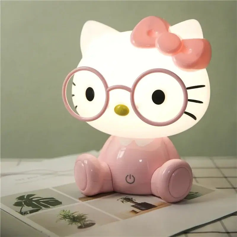Pink and red decorbites cartoon animal night light featuring hello kitty with round glasses and bow for bedroom decor