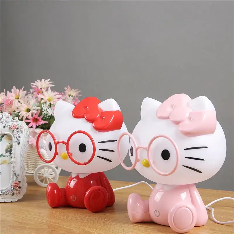 Two hello kitty-themed night light table lamps in red and pink with bows and glasses decorbites cartoon animal night light