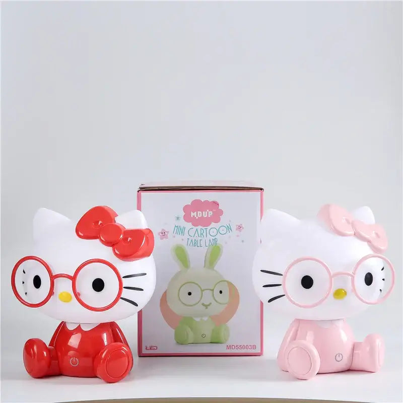 Two hello kitty-themed pink and red decorbites cartoon animal night light bedroom table lamps with bows and glasses