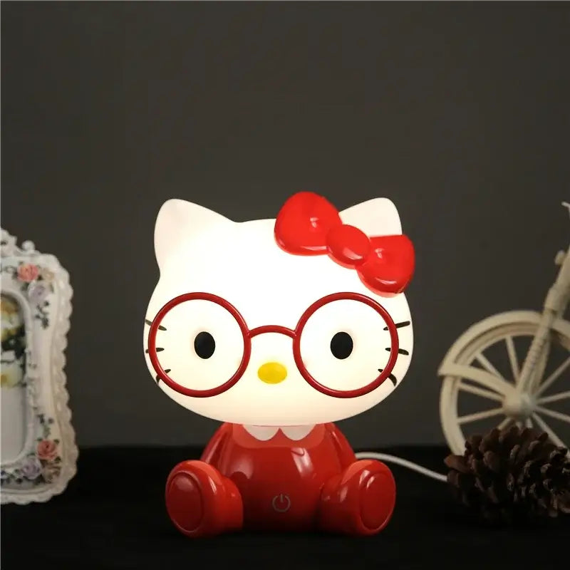 White and red hello kitty night light with round glasses and bow featuring a glossy finish decorbites cartoon animal night