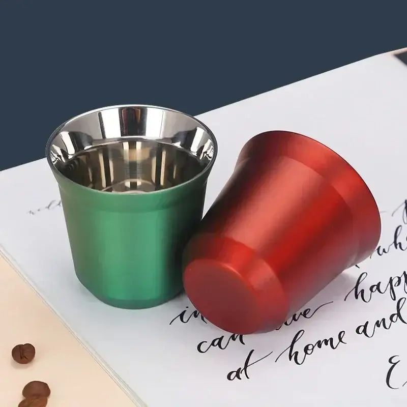 Two double wall espresso mugs in emerald green and red with stainless steel interior and minimalist design from a set of 3