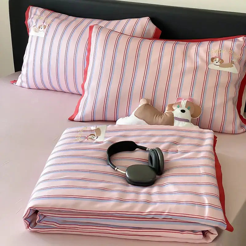Pink and blue striped satin pillowcases with red trim and embroidered dogs complement decorbites cool lyocell fiber blanket set