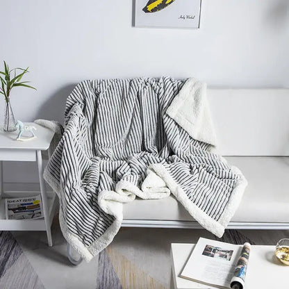 Cozy nordic wool gray and white striped fleece throw blanket with plush textured surface for decorbites cozy nordic use