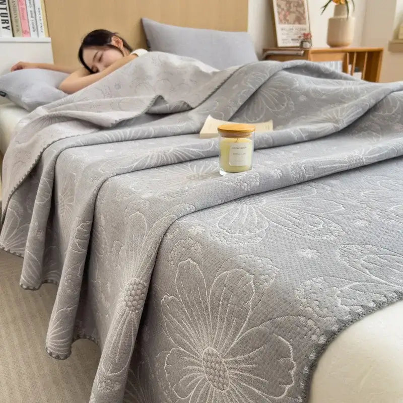 Gray floral-patterned decorbites cotton towel blanket with a soft textured weave for bedroom quilt use