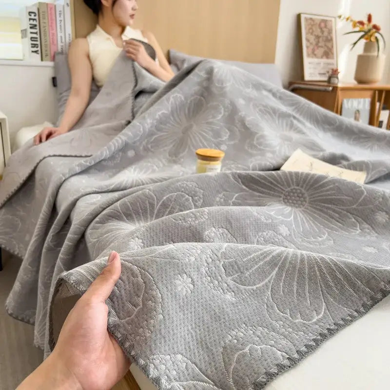 Gray floral-patterned decorbites cotton towel blanket with soft textured weave and subtle embroidered details
