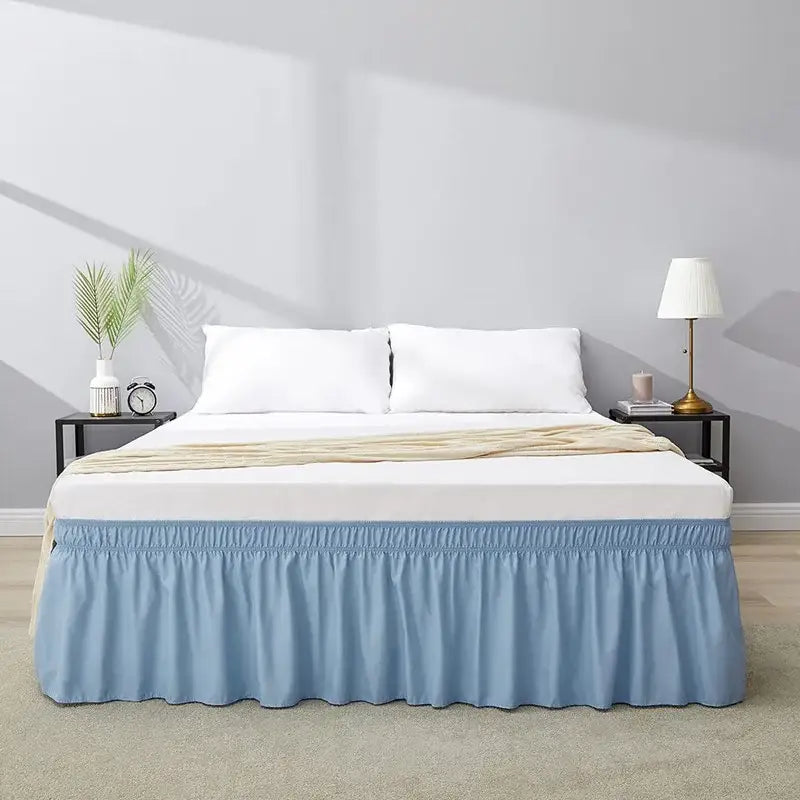 Light blue ruffled elastic bed skirt with soft fabric and elasticated waistband for a solid color bedroom wrap around