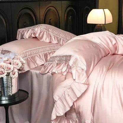 Pink satin bedding set with delicate ruffled edges and subtle embroidery trim from decorbites 1000tc luxury collection