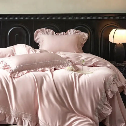 Soft pink satin bedding set with delicate ruffled edges and lace trim from decorbites 1000tc luxury embroidery collection