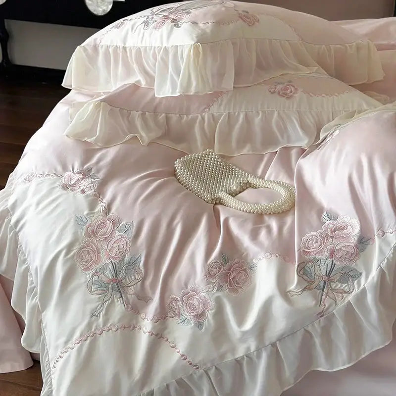 A delicate pearl-embellished handbag on a pink satin egyptian cotton flowers bedding set with lace ruffles