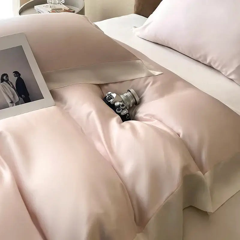 Pink satin eucalyptus fiber bedding set featuring a soft blush color with glossy finish and elegant ruffled edges
