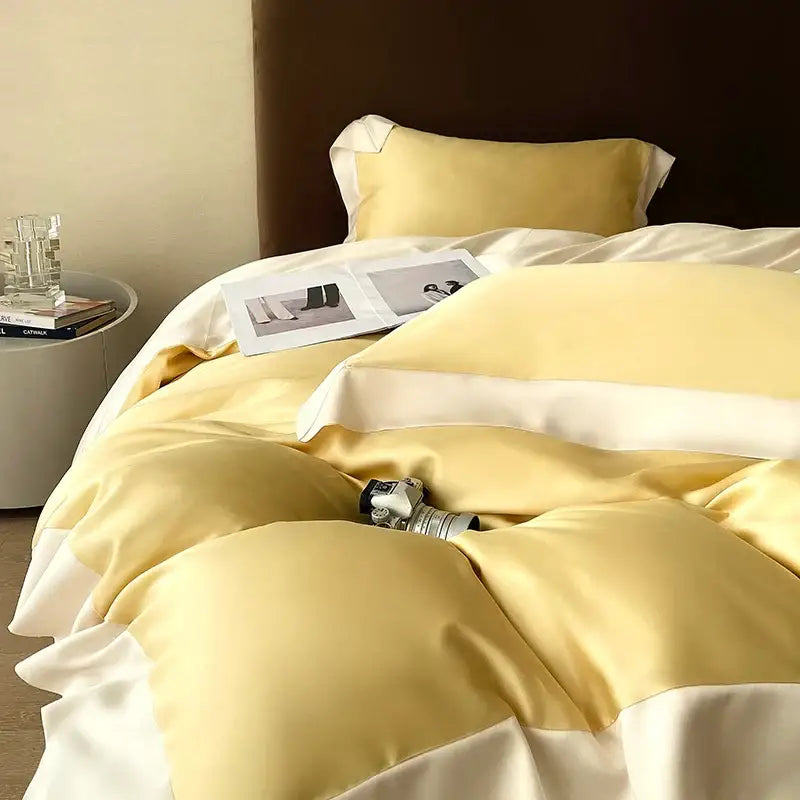 Cream and pale yellow satin bedding set with soft sheen made from eucalyptus fiber by decorbites for bedroom luxury
