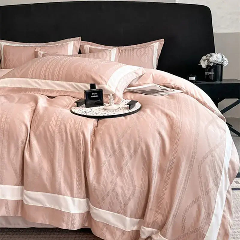 Pink satin jacquard duvet cover set with subtle geometric embroidery and crisp white piping for bedroom use
