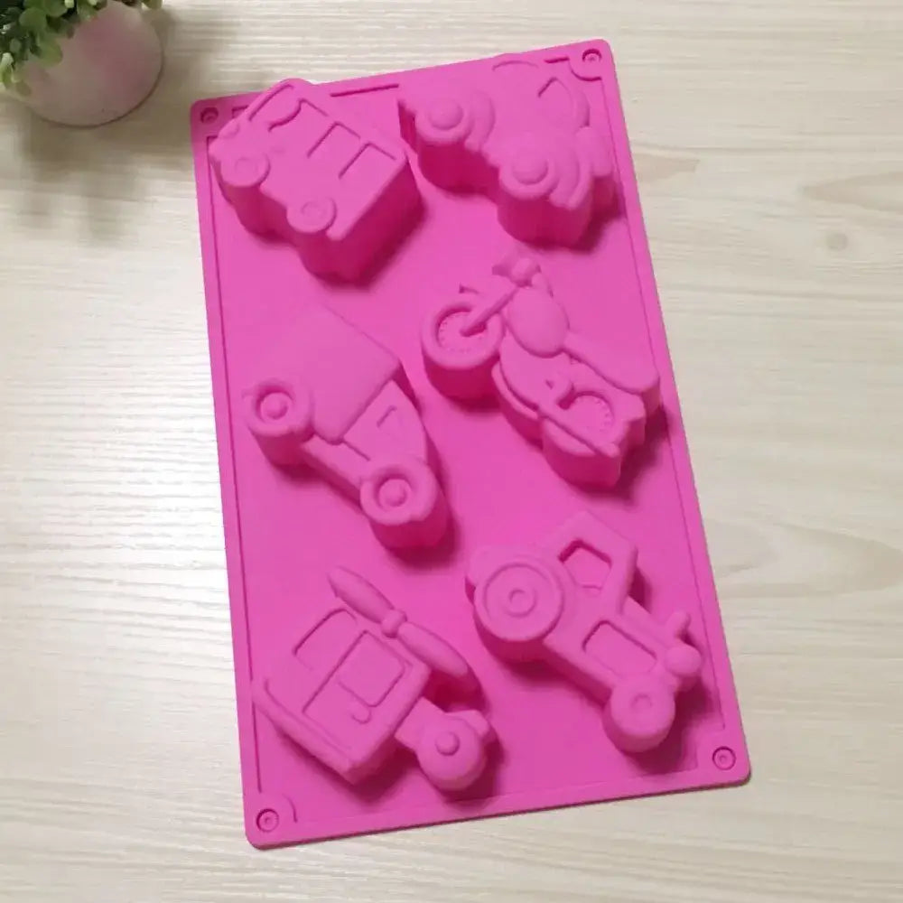 Pink silicone cake mould featuring six vehicle shapes including airplane car by decorbites creative airplane for baking