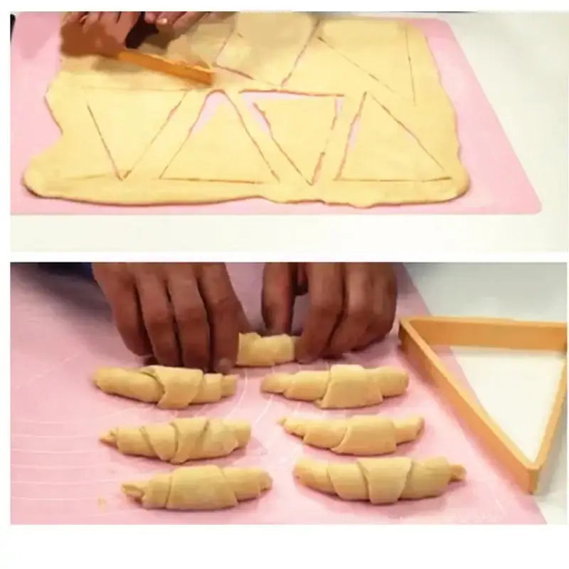 Golden crescent-shaped croissants freshly rolled on a pink silicone mat using decorbites croissant maker pastry tools