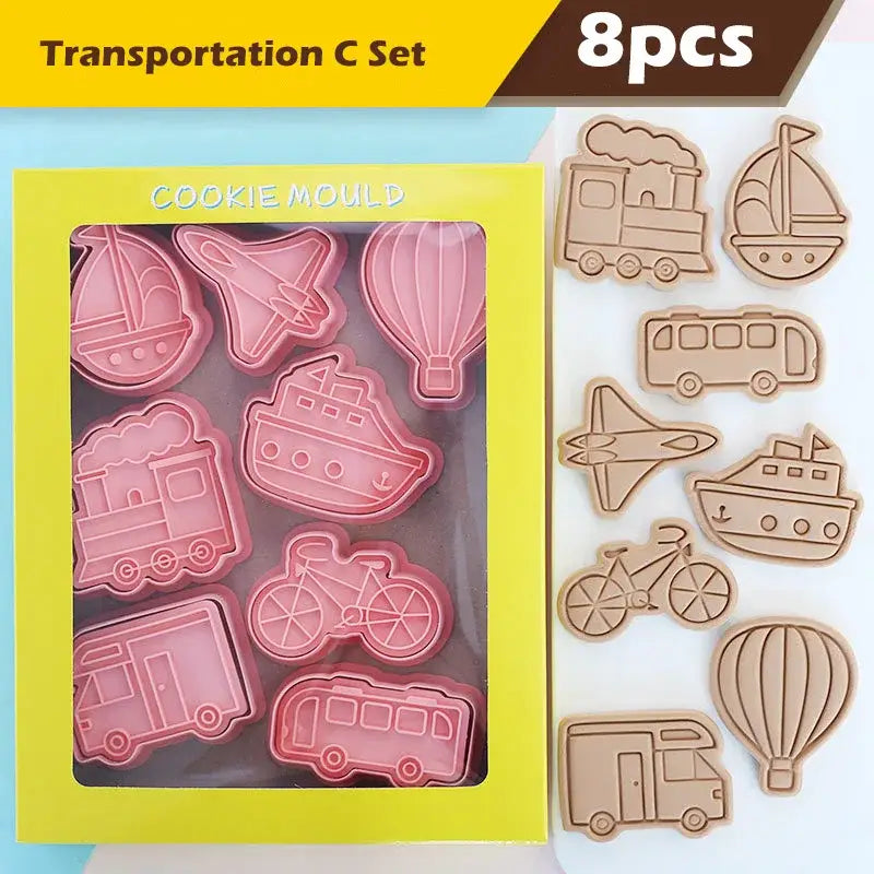 Set of eight pink and beige silicone truck cookie cutters with vehicle and aircraft shapes for baking use