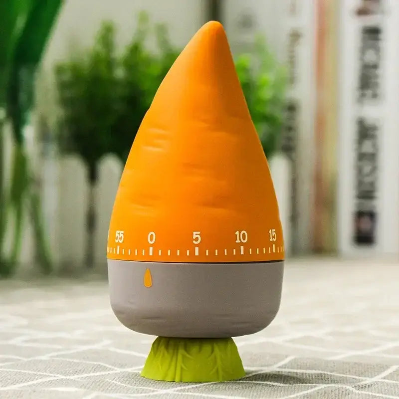 Orange and gray carrot-shaped kitchen timer with green leafy base as a cute cartoon cake kitchen timer for baking use