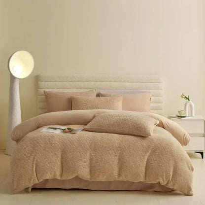 Beige textured duvet set with matching pillows and tufted headboard in winter fleece bedding set for bedroom