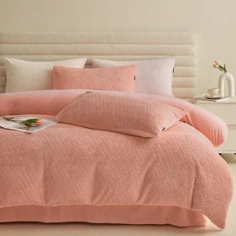 Soft pink textured winter fleece bedding set with matching pillows and plush ribbed fabric finish for bedroom use