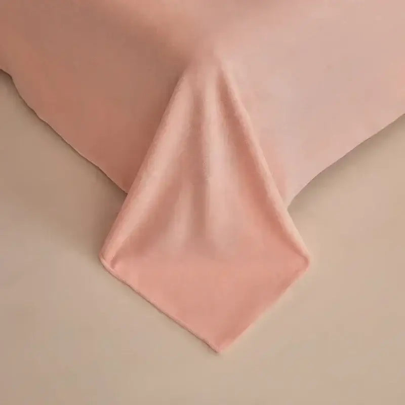 Soft blush pink winter fleece bedding set featuring smooth textured fabric with gentle folds and a clean hem