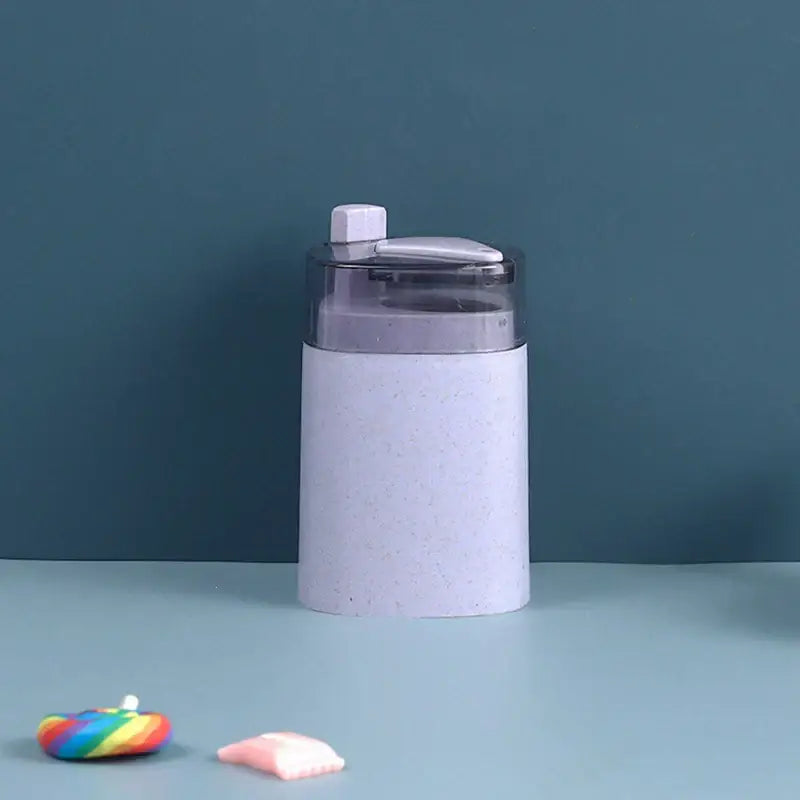 Light purple speckled automatic toothpick dispenser holder with transparent lid and white flip-top cap for kitchen storage