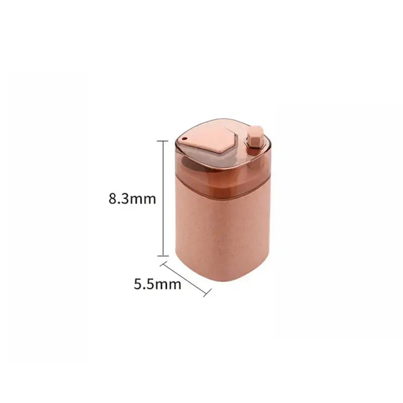 Rose gold automatic toothpick dispenser holder with a translucent lid and textured body for kitchen storage