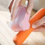Pink translucent plastic carrot-shaped afralia snail peeler kitchen vegetable tool for efficient peeling