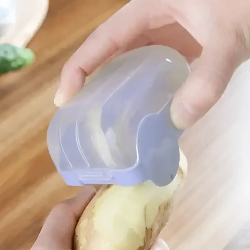 Translucent purple silicone egg cooker with ridged lid and rounded handle in pink translucent afralia snail peeler design